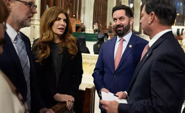 Rep. Mike Lawler, R-N.Y., second from right, arrives for the Mass of Installation of Archbishop Ronald Hicks at St. Patrick's Cathedral, Friday, Feb. 6, 2026, in New York. (AP Photo/Yuki Iwamura)