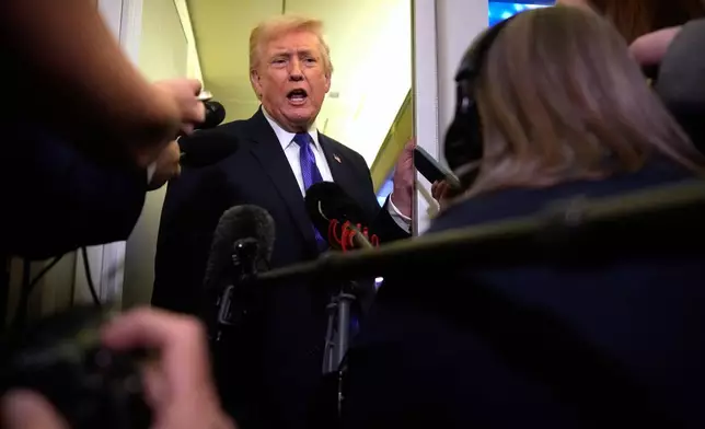 President Donald Trump speaks to reporters as he flies aboard Air Force One from Joint Base Andrews, Md., to West Palm Beach, Fla., Friday, Feb. 6, 2026 (AP Photo/Mark Schiefelbein)