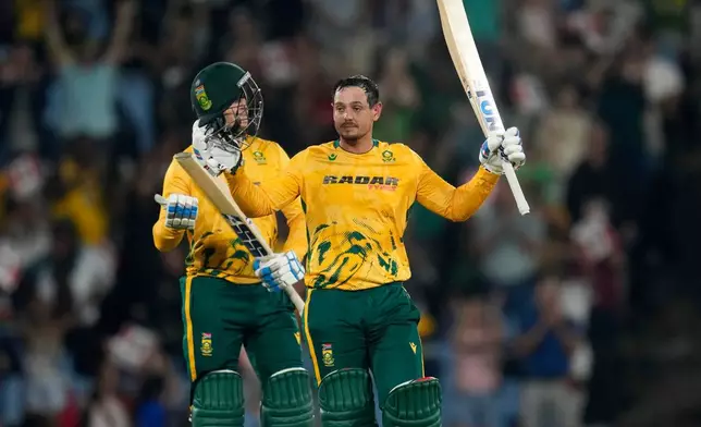 South Africa's batsman Quinton de Kock raises his bat after reaching a century during the T20 International cricket match between South Africa and West Indies, in Centurion, South Africa, Thursday, Jan. 29, 2026. (AP Photo/Themba Hadebe)