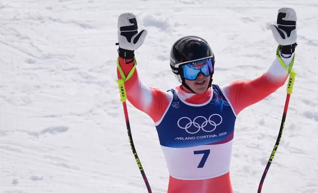 Switzerland's Franjo von Allmen celebrates at the finish area of an alpine ski, men's super-G race, at the 2026 Winter Olympics, in Bormio, Italy, Wednesday, Feb. 11, 2026. (AP Photo/Rebecca Blackwell)