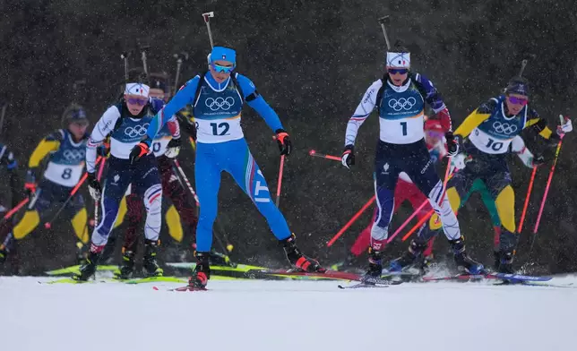 Dorothea Wierer, of Italy, front left, competes in the women's 12.5-kilometer mass start biathlon race at the 2026 Winter Olympics in Anterselva, Italy, Saturday, Feb. 21, 2026. (AP Photo/Mosa'ab Elshamy)