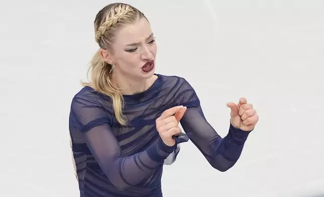 Amber Glenn of the United States competes during the women's figure skating free program at the 2026 Winter Olympics, in Milan, Italy, Thursday, Feb. 19, 2026. (AP Photo/Francisco Seco)