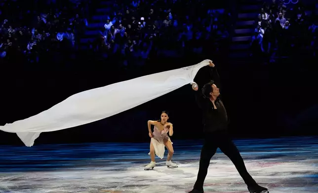 Madison Chock and Evan Bates of the United States perform during the figure skating exhibition at the 2026 Winter Olympics, in Milan, Italy, Saturday, Feb. 21, 2026. (AP Photo/Ashley Landis)