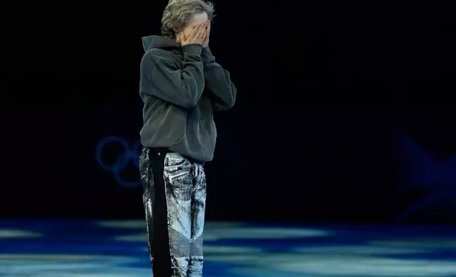 Ilia Malinin of the United States reacts after his performance during the figure skating exhibition at the 2026 Winter Olympics, in Milan, Italy, Saturday, Feb. 21, 2026. (AP Photo/Ashley Landis)