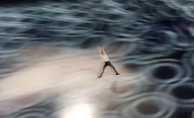 Daniel Grassl of Italy performs during the figure skating exhibition at the 2026 Winter Olympics, in Milan, Italy, Saturday, Feb. 21, 2026. (AP Photo/Francisco Seco)