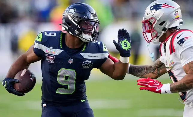 Seattle Seahawks running back Kenneth Walker III (9) runs with the ball during the first half of the NFL Super Bowl 60 football game against the New England Patriots, Sunday, Feb. 8, 2026, in Santa Clara, Calif. (AP Photo/Brynn Anderson)