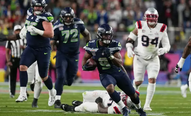 Seattle Seahawks running back Kenneth Walker III (9) carries during the second half of the NFL Super Bowl 60 football game against the New England Patriots, Sunday, Feb. 8, 2026, in Santa Clara, Calif. (AP Photo/Matt Slocum)