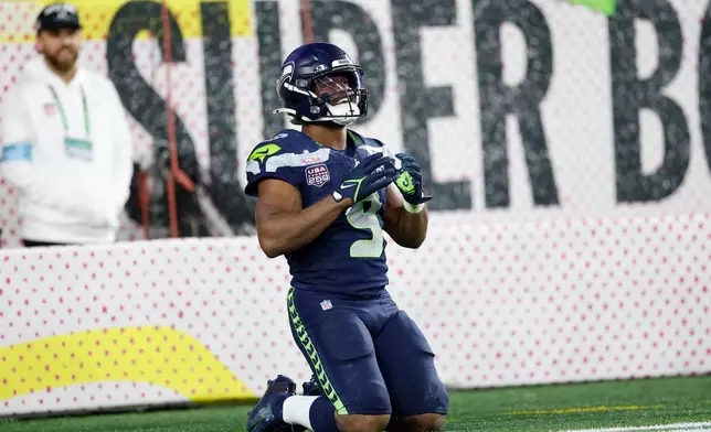 Seattle Seahawks' Kenneth Walker III smiles after his fourth quarter touchdown was nullified by a holding penalty during the Super Bowl 60 in Santa Clara, Calif., Sunday, Feb. 8, 2026. (Scott Strazzante/San Francisco Chronicle via AP)