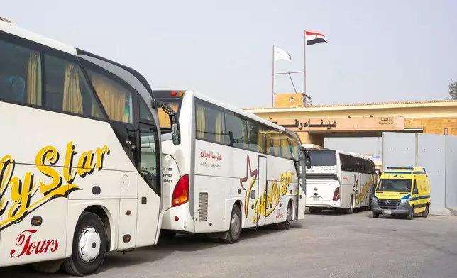 Buses line up to enter the Egyptian gate of the Rafah crossing into the Gaza Strip, in Rafah, Egypt, Monday, Feb. 2, 2026. (AP Photo/Mohamed Arafat)
