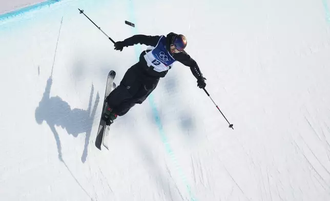New Zealand's Mischa Thomas loses her phone while competing during the women's freestyle skiing halfpipe final at the 2026 Winter Olympics, in Livigno, Italy, Sunday, Feb. 22, 2026. (AP Photo/Abbie Parr)