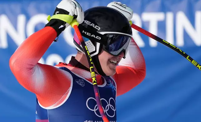 Switzerland's Franjo von Allmen celebrates at the finish area of an alpine ski men's downhill race, at the 2026 Winter Olympics, in Bormio, Italy, Saturday, Feb. 7, 2026. (AP Photo/Rebecca Blackwell)