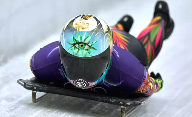 Puerto Rico's Kellie Delka arrives at the finish during a women's skeleton training session at the 2026 Winter Olympics, in Cortina d'Ampezzo, Italy, Tuesday, Feb. 10, 2026. (AP Photo/Alessandra Tarantino)