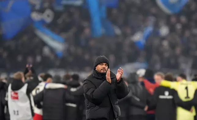 Munich's head coach Vincent Kompany applauds after the German Bundesliga soccer match between Hamburger SV and FC Bayern Munich in Hamburg, Germany, Saturday, Jan. 31, 2026. (Marcus Brandt/dpa via AP)