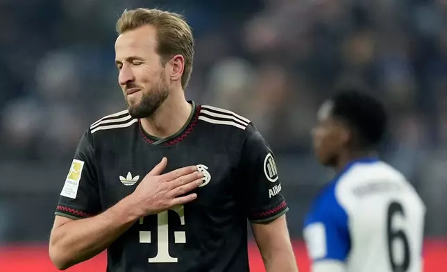 Munich's scorer Harry Kane reacts during the German Bundesliga soccer match between Hamburger SV and FC Bayern Munich in Hamburg, Germany, Saturday, Jan. 31, 2026. (Marcus Brandt/dpa via AP)