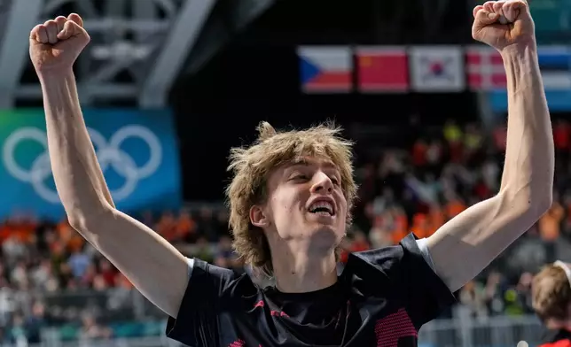 Metodej Jilek of Czechia celebrates winning the gold medal in the men's 10,000 meters speedskating race at the 2026 Winter Olympics, in Milan, Italy, Friday, Feb. 13, 2026. (AP Photo/Luca Bruno)