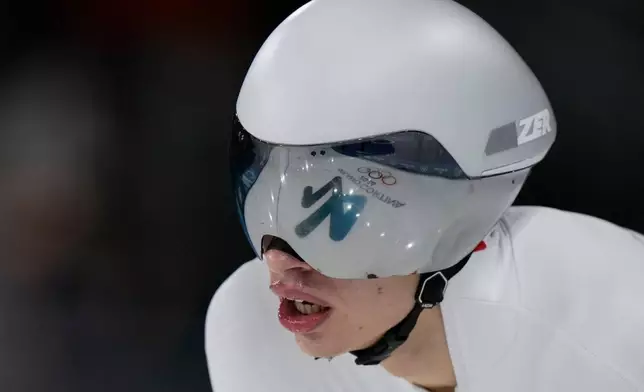 Vladimir Semirunniy of Poland catches his breath after the men's 10,000 meters speedskating race at the 2026 Winter Olympics, in Milan, Italy, Friday, Feb. 13, 2026. (AP Photo/Luca Bruno)