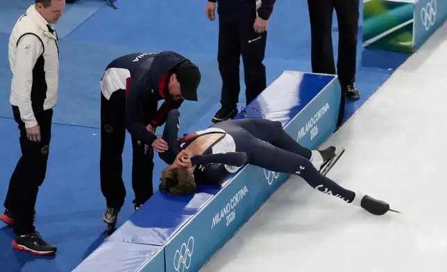 Czechia's Metodej Jilek lies on the pads after competing in the men's 10,000-meters speedskating final at the 2026 Winter Olympics, in Milan, Italy, Friday, Feb. 13, 2026. (AP Photo/David J. Phillip)