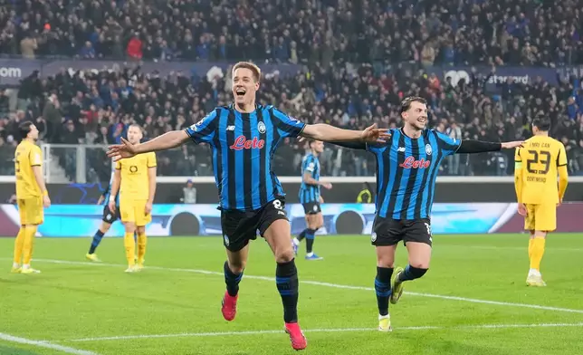 Atalanta's Mario Pasalic celebrates after scoring their third goal during the Champions League second leg playoff match between Atalanta and Borussia Dortmund in Bergamo, Italy, Wednesday, Feb. 25, 2026. (Spada/LaPresse via AP)