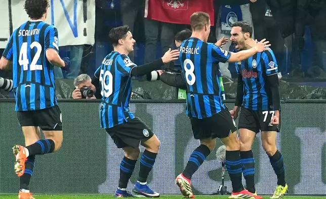 Atalanta's Davide Zappacosta (77) celebrates after scoring their second goal during the Champions League second leg playoff match between Atalanta and Borussia Dortmund in Bergamo, Italy, Wednesday, Feb. 25, 2026. (Spada/LaPresse via AP)