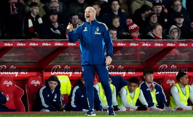 Nottingham Forest manager Sean Dyche signals during the English Premier League soccer match between Nottingham Forest and Wolverhampton Wanderers, in Nottingham, England, Wednesday, Feb. 11, 2026. (Mike Egerton/PA via AP)