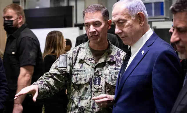 Adm. Brad Cooper, commander of U.S. Central Command, and members of the Israeli Defense Forces host Israeli Prime Minister Benjamin Nentanyahu inside the Civil-Military Coordination Center (CMCC) Oct. 29, 2025, in Israel. (Staff Sgt. Michael Ito/U.S. Army via AP))