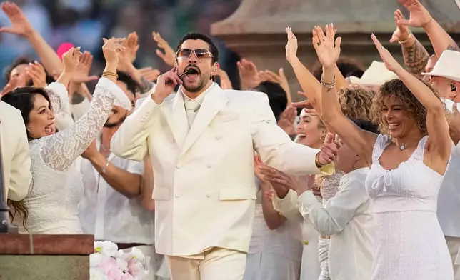 Bad Bunny performs during halftime of the NFL Super Bowl 60 football game between the New England Patriots and the Seattle Seahawks, Sunday, Feb. 8, 2026, in Santa Clara, Calif. (AP Photo/Julio Cortez)