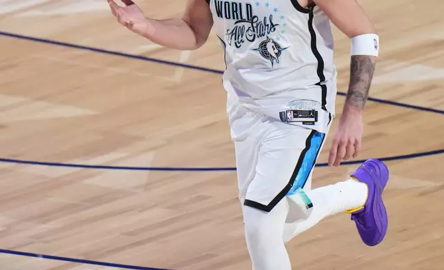 World forward Luka Dončić, of Slovenia, dribbles during the NBA All-Star basketball game against the USA Stars Sunday, Feb. 15, 2026, in Inglewood, Calif. (AP Photo/Jae C. Hong)
