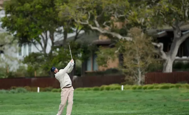 Kansas City Chiefs' Travis Kelce hits from the second fairway at Pebble Beach Golf Links during the second round of the AT&amp;T Pebble Beach Pro-Am golf tournament in Pebble Beach, Calif., Friday, Feb. 13, 2026. (AP Photo/Godofredo A. Vásquez)