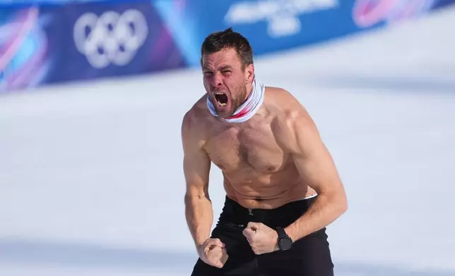 Austria's Benjamin Karl celebrates winning the gold medal in the men's snowboarding parallel giant slalom finals at the 2026 Winter Olympics, in Livigno, Italy, Sunday, Feb. 8, 2026. (AP Photo/Lindsey Wasson)