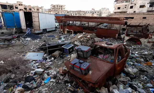 Equipment used by a television crew filming an episode of the TV series "Al-Souriyoun al-Aada" ("The Syrian Enemies"), based on a novel of the same name that was banned under Bashar Assad, sits in a war-damaged area of central Aleppo, Syria, Friday, Feb. 13, 2026. (AP Photo/Omar Sanadiki)