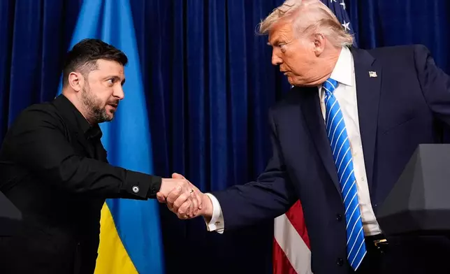 FILE - President Donald Trump, right, and Ukraine's President Volodymyr Zelenskyy shake hands at the start of a joint news conference following a meeting at Trump's Mar-a-Lago club, Dec. 28, 2025, in Palm Beach, Fla. (AP Photo/Alex Brandon, File)
