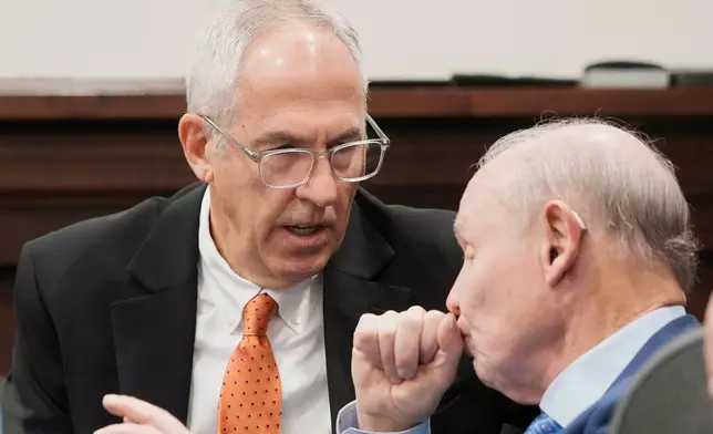 Michael Dowling, left, talks with his attorney, Dan Webb, before the start of his trial in Summit County Court of Common Pleas Judge Susan Baker Ross's courtroom on Tuesday, Feb. 3, 2026, in Akron, Ohio. (Mike Cardew/Akron Beacon Journal via AP, Pool)