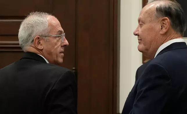Defendants Michael Dowling, left, and Chuck Jones wait for the start of their trial in Summit County Court of Common Pleas Judge Susan Baker Ross's courtroom on Tuesday, Feb. 3, 2026, in Akron, Ohio. (Mike Cardew/Akron Beacon Journal via AP, Pool)