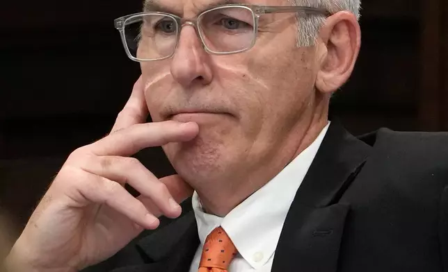 Defendant Michael Dowling, a former FirstEnergy Services Corp. Senior Vice President, listens to Carole Rendon, attorney for fellow defendant Chuck Jones as she gives her opening statement in the their trial in Summit County Court of Common Pleas Judge Susan Baker Ross's courtroom, Tuesday, Feb. 3, 2026, in Akron, Ohio. (Mike Cardew/Akron Beacon Journal via AP, Pool)