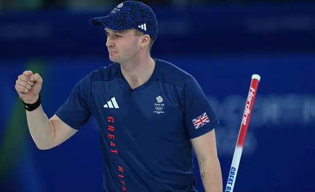 Britain's Bruce Mouat celebrates after winning the mixed doubles round robin phase of the curling competition against Canada at the 2026 Winter Olympics, in Cortina d'Ampezzo, Italy, Saturday, Feb. 7, 2026. (AP Photo/Fatima Shbair)