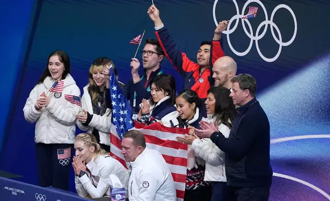 Amber Glenn of the United States reacts to her scores after competing during the figure skating women's team event at the 2026 Winter Olympics, in Milan, Italy, Sunday, Feb. 8, 2026. (AP Photo/Natacha Pisarenko)