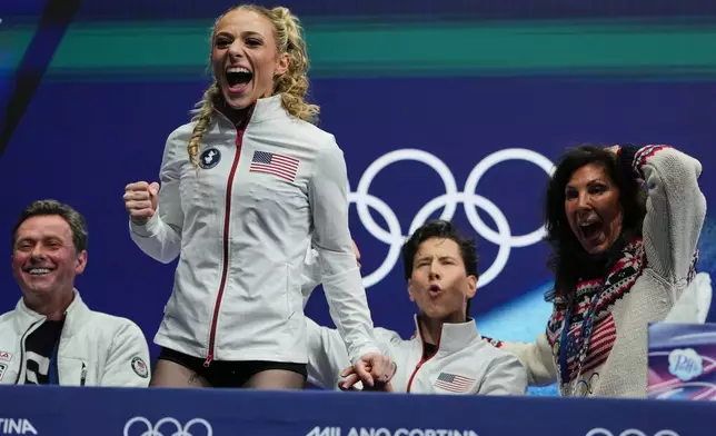 Emilea Zingas and Vadym Kolesnik of the United States react to their scores after competing during the rhythm dance in figure skating at the 2026 Winter Olympics, in Milan, Italy, Monday, Feb. 9, 2026. (AP Photo/Natacha Pisarenko)