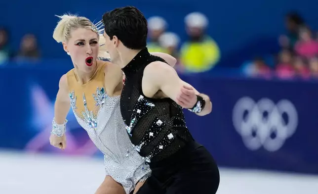 Piper Gilles and Paul Poirier of Canada compete during the rhythm dance in figure skating at the 2026 Winter Olympics, in Milan, Italy, Monday, Feb. 9, 2026. (AP Photo/Natacha Pisarenko)