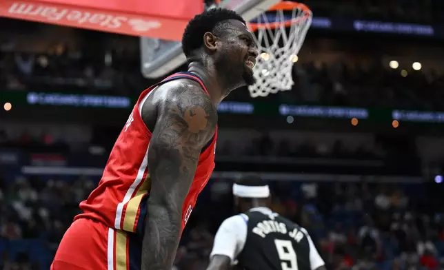 New Orleans Pelicans forward Zion Williamson celebrates after dunking in the first half of an NBA basketball game against the Milwaukee Bucks in New Orleans, Friday, Feb. 20, 2026. (AP Photo/Ella Hall)