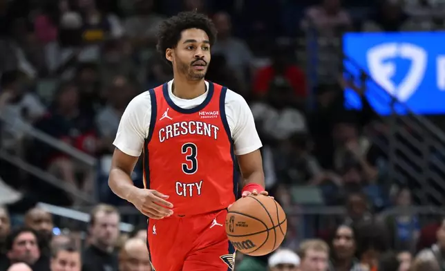 New Orleans Pelicans guard Jordan Poole looks to pass the ball in the first half of an NBA basketball game against the Milwaukee Bucks in New Orleans, Friday, Feb. 20, 2026. (AP Photo/Ella Hall)