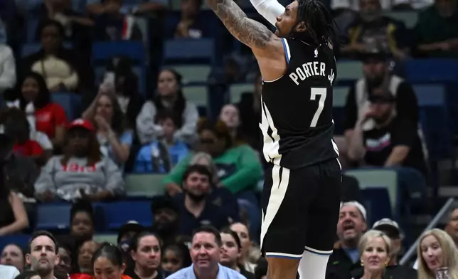 Milwaukee Bucks guard-forward Kevin Porter Jr. (7) shoots the ball in the first half of an NBA basketball game against the New Orleans Pelicans in New Orleans, Friday, Feb. 20, 2026. (AP Photo/Ella Hall)