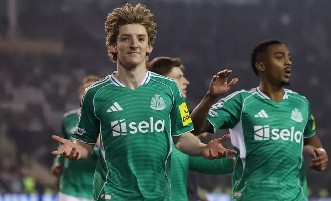 Newcastle's Anthony Gordon, left, celebrates after scoring his side's first goal during the Champions League play-off first leg soccer match between Qarabag and Newcastle in Baku, Azerbaijan, Wednesday, Feb. 18, 2026. (AP Photo)