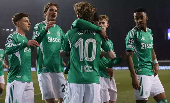Newcastle's Anthony Gordon, centre, celebrates with teammates after scoring his side's first goal during the Champions League play-off first leg soccer match between Qarabag and Newcastle in Baku, Azerbaijan, Wednesday, Feb. 18, 2026. (AP Photo)