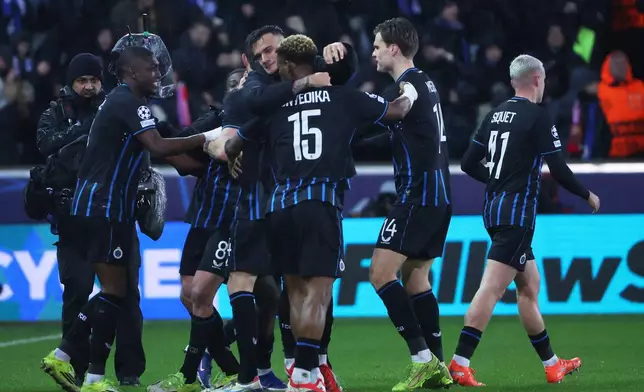 Brugge's team celebrate after Christos Tzolis scored his side's third goal during the Champions League play-off first leg soccer match between Club Brugge and Atletico Madrid, in Bruges, Belgium, Wednesday, Feb. 18, 2026. (AP Photo/Omar Havana)