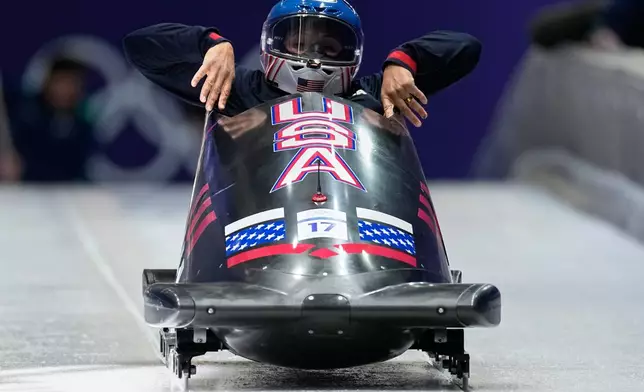 United States' Elana Meyers Taylor starts for a women's monobob training session at the 2026 Winter Olympics, in Cortina d'Ampezzo, Italy, Friday, Feb. 13, 2026. (AP Photo/Aijaz Rahi)