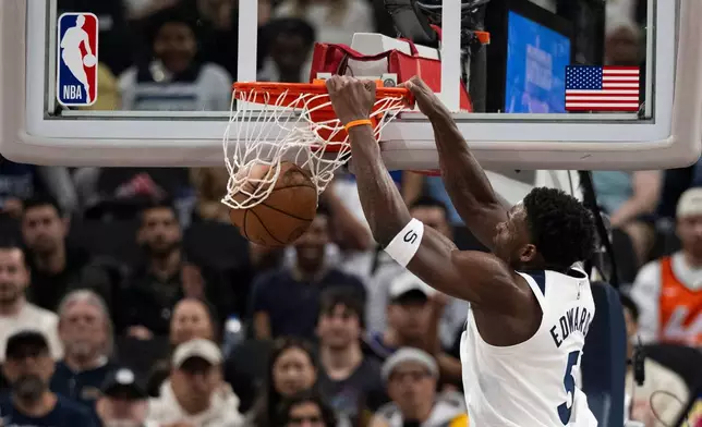 Minnesota Timberwolves guard Anthony Edwards (5) dunks during the first half of an NBA basketball game against the Los Angeles Clippers Thursday, Feb. 26, 2026, in Inglewood, Calif. (AP Photo/Kyusung Gong)