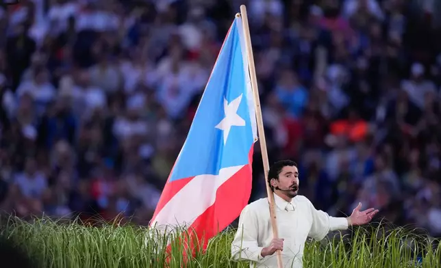 Bad Bunny performs during halftime of the NFL Super Bowl 60 football game between the New England Patriots and the Seattle Seahawks, Sunday, Feb. 8, 2026, in Santa Clara, Calif. (AP Photo/Mark J. Terrill)