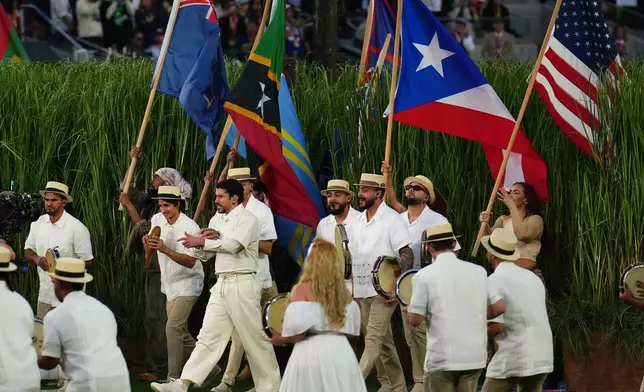 Bad Bunny performs during halftime of the NFL Super Bowl 60 football game between the New England Patriots and the Seattle Seahawks, Sunday, Feb. 8, 2026, in Santa Clara, Calif. (AP Photo/Godofredo A. Vásquez)