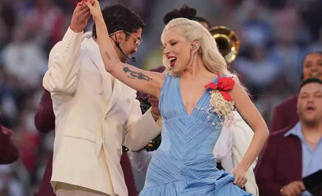 Bad Bunny and Lady Gaga perform during halftime of the NFL Super Bowl 60 football game between the New England Patriots and the Seattle Seahawks, Sunday, Feb. 8, 2026, in Santa Clara, Calif. (AP Photo/Matt Slocum)