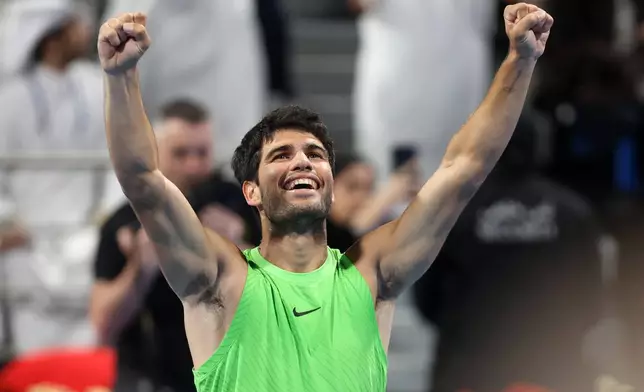 Spain's Carlos Alcaraz celebrates after beating Arthur Fils of France during the final of Qatar Open tennis in Doha, Qatar, Saturday Feb. 21, 2026. (AP Photo/Hussein Sayyed)